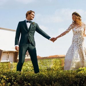 pan młody w garniturze ślubnym, w kamizelce, w muszce, w koszuli białej. Kolekcja Wilvorst Green Wedding 2024